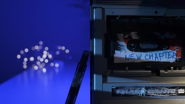 New Chapter Sign on Audio Cassette Label Which is Inserted Into Old Retro Broken Silver Turntable alt