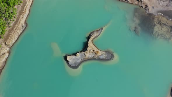 Drone View of the Turquoise Lake Formed As a Result of Mining Waste alt