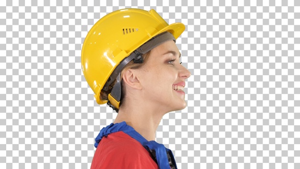 The Young Woman Engineer with Yellow Safety Helmet Walking alt