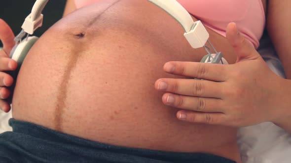 Happy Pregnant Woman and Expecting Baby at Home alt