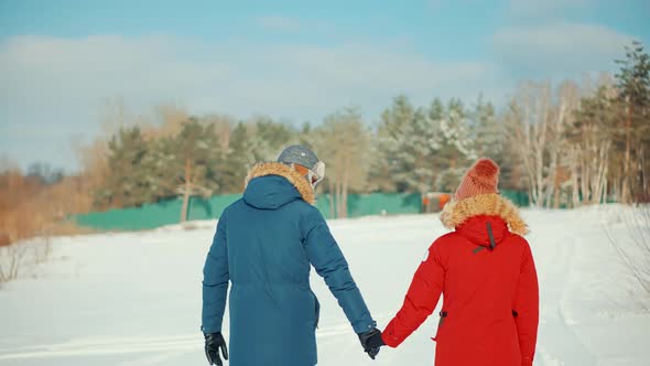 Relax Lifestyle Having Fun In Cold Day. Couple Walking And Enjoying Winter. Freezing Day On Holiday. alt