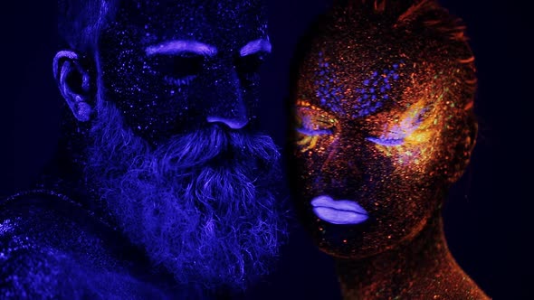 Man and Woman Face in Ultraviolet Light
