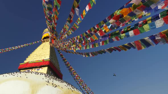 Buddhist Prayer Flags (Dar Cho) on Boudhanath Stupa in Kathmandu, Nepal. Slow Motion Shot alt
