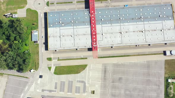A huge shopping center and parking near it. view from above.aerial photography. Empty alt