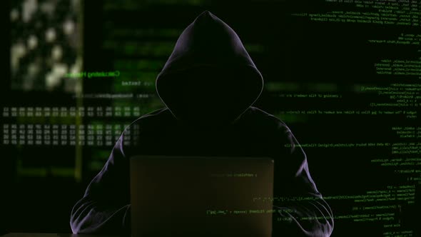 Hacker Opening Laptop to Check Virus Breaking System Codes, Stealing Data alt