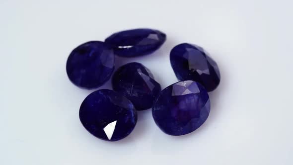 Natural Dark Blue Sapphires Gemstone on the Background