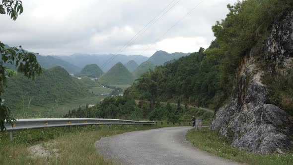 Motorcycles with Young People Are Riding Along the Road In the Mountains Around the Forest A View of