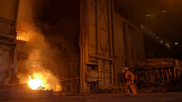 Metallurgist at Work By the Blast Furnance, Iron and Steel Works alt