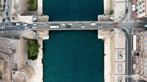 Top view of bridge with traffic. Taranto city