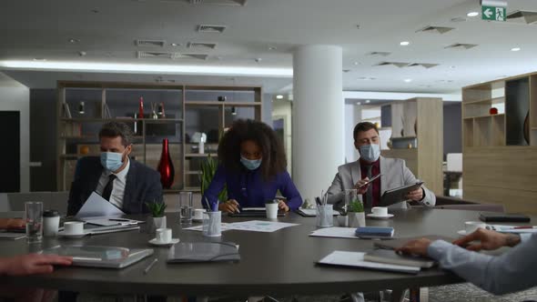 Entrepreneurs Finish Conference Meeting Leaving Office Wearing Covid Face Masks alt