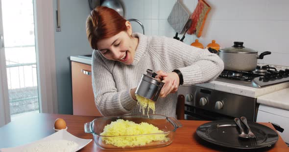 Girl is Mashing Boiled Potatoes to Make Homemade Croquettes alt