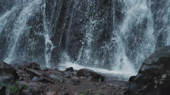 Waterfall crashes into the river