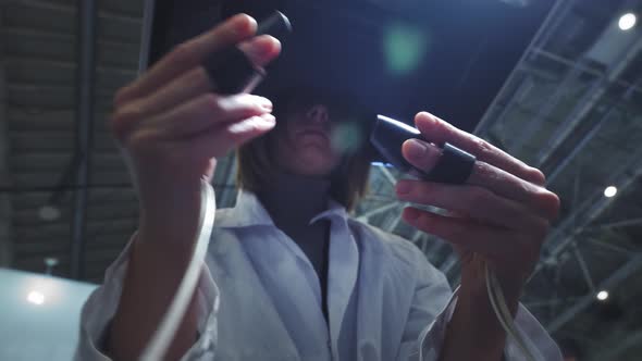 A Girl Surgeon Performs an Operation on a Patient in Virtual Reality alt