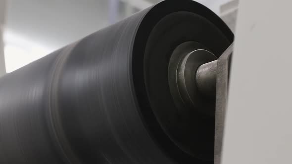 black bobbin is spinning on the machine close-up alt