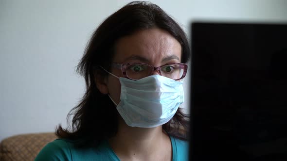 Woman Put on Mask, Reading New About Pandemia of Virus on Laptop, Looking Scared Shocked and