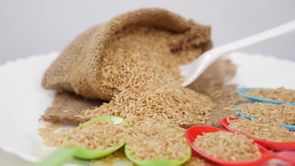 View of plastic spoon stuck in sesame seeds bag alt