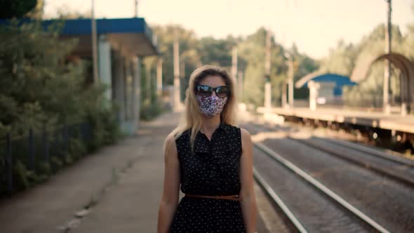 Woman In Mask Protection Epidemic Coronavirus On Public Transport Station. Girl Waiting Train. alt