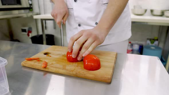 Slicing a Tomato on a Wooden Tray alt