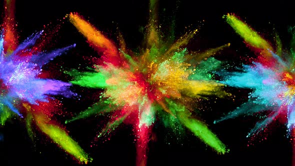 Multiple Color Powder Explosions in Super Slow Motion Isolated on Black Background alt