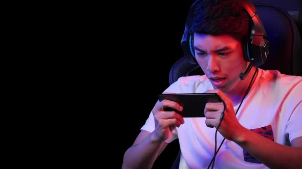 man playing game on smartphone alt