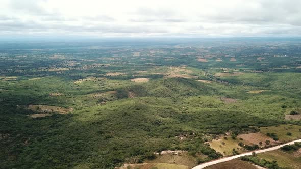 Aerial View of the Green Plains in Mountains and Trafic Road, Tanzania, Africa. The the Green Hills alt