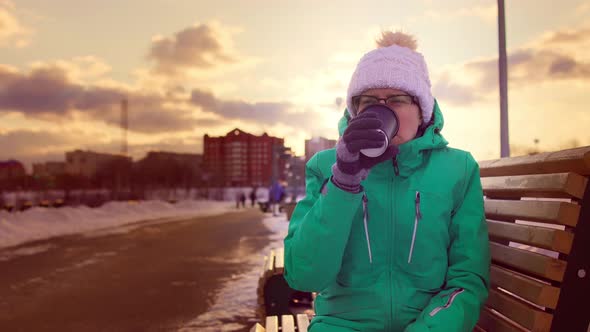 Woman Finishes Coffee From Paper Cup Turns It Over Slaps Bottom Checking Remains alt