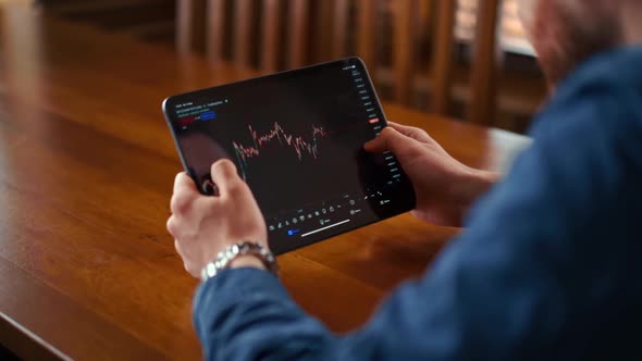 Businessman checking bitcoin price chart on digital exchange on mobile phone screen, cryptocurrency alt