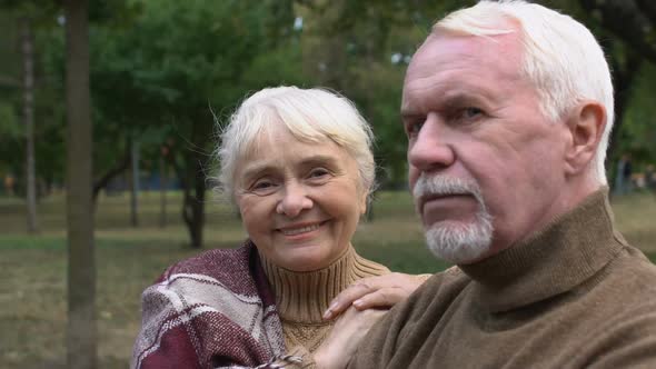 Happy Old Couple Posing to Camera Sitting Bench in Park, Togetherness, Close-Up