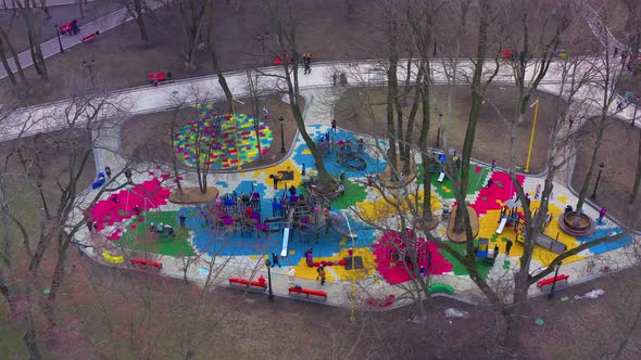 Children's Colourful Outside Playground with Carousels Swings and Slides
