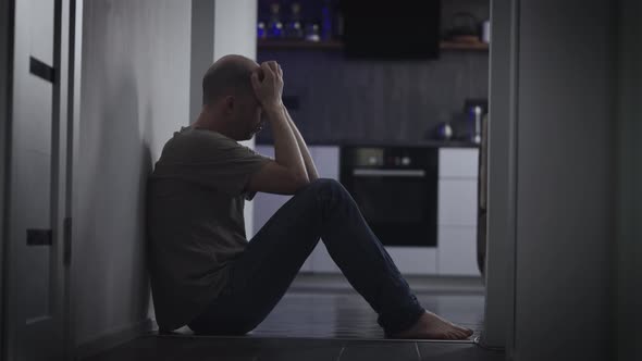 A Man in a Deep Depression Due to a Midlife Crisis alt