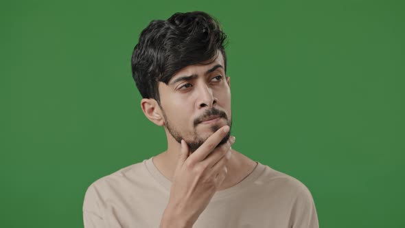 Portrait Arabic Man Stand in Green Studio Thoughtful Indian Guy Pondering Create Plan Search for alt
