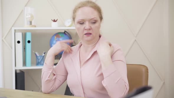 Caucasian Redhead Woman Suffering From Climacteric Changes. Senior Lady Having Hot Flashes and alt