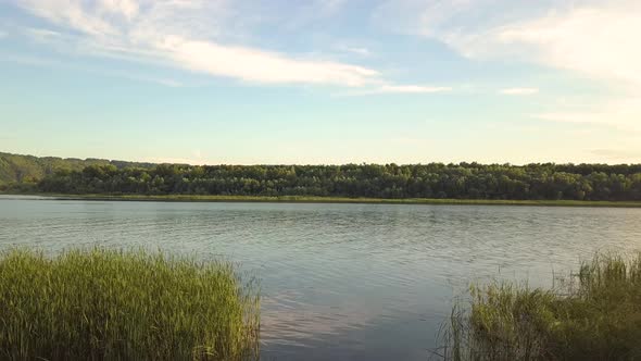 Aerial view of wide Dnister river and distant rocky hills in Bakota area, part of the National park alt