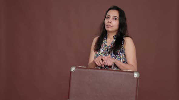 Cheerful Indian Person Leaving on Vacation Trip with Suitcase alt