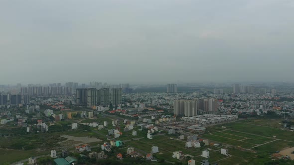 panoramic drone shot of Thu Thiem development area of Ho Chi Minh City with Saigon river, city skyli alt