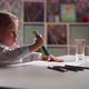 Talented Girl Draws Picture with Crayons Bunch in Room - VideoHive Item for Sale