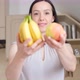 Beautiful Brunette Woman Holding an Apple and a Banana Organic Fruit - VideoHive Item for Sale