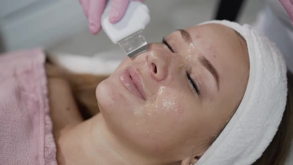 Close View of Woman During Cosmetological Ultrasonic Facial Cleansing alt