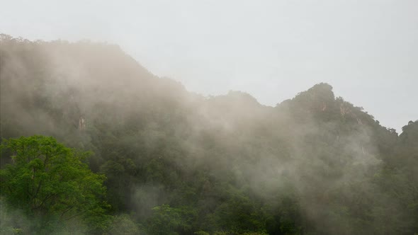 Morning clouds over mountains at sunrise