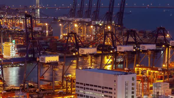 Timelapse Illuminated Hong Kong Harbour with Gantry Cranes alt