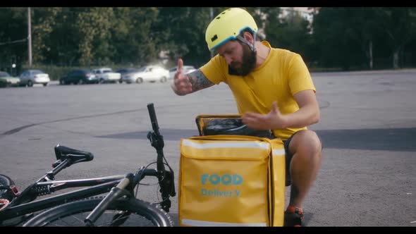 Delivery Man Searching in His Backpack alt