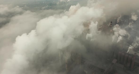 Top View of the Metallurgical Plant. Smoke Coming Out of Factory Pipes. Ecology alt