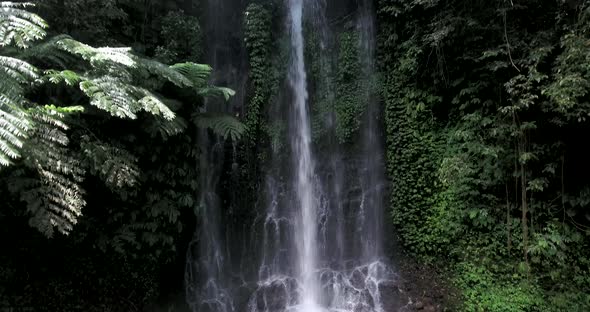 Flying up and around Pucak Manik waterfall near Bratan, Bali, Indonesia