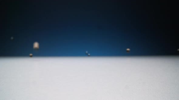 Pouring From Above Gold Hydrogel Capsules alt