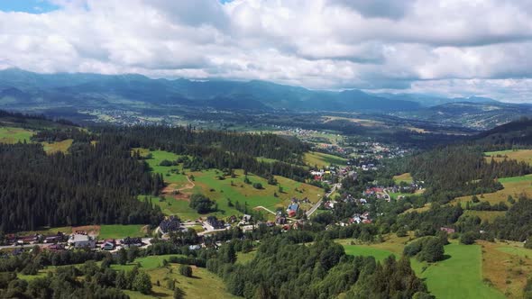 Flight Over a Mountain Cottage Village in Poland, Zakopany, Tatra National Park Aerial 4K Video alt