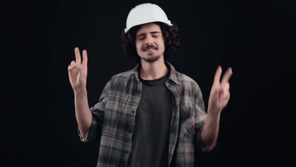 The Cheerful Charismatic Engineer Brings His Fingers in Peace and Dances Modestly and Happily