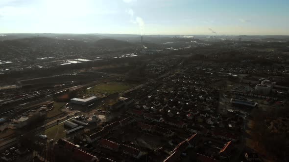 Residential Area and Industrial Background with Pollution Aerial alt