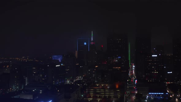 Drone Flying Towards Mercantile National Bank Building with Tower and Big Neon Clock alt