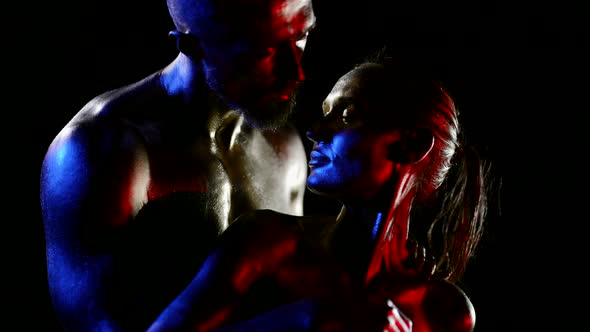 Body Art Sensual Lovers are Stroking Bodies Covered Shiny Dye in Darkness Art Light alt