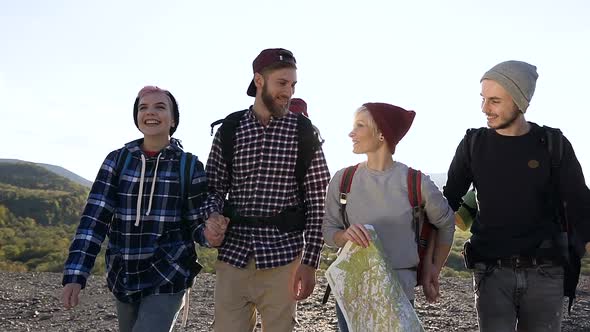 Group of Four Travelers Friends are Walking With the Wap alt